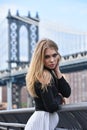 Outdoor portrait of young blond sensual woman posing in elegant clothes on the pier. Royalty Free Stock Photo