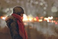 Outdoor portrait of young man in winter with bokeh