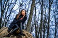 Outdoor portrait of young pretty beautiful woman in cold sunny day in park Royalty Free Stock Photo