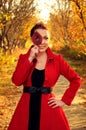 Outdoor portrait of young redheaded woman in autumn forest Royalty Free Stock Photo