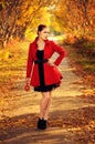 Outdoor portrait of young redheaded woman in autumn forest Royalty Free Stock Photo