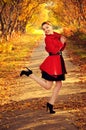 Outdoor portrait of young redheaded woman in autumn forest Royalty Free Stock Photo