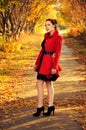 Outdoor portrait of young redheaded woman in autumn forest Royalty Free Stock Photo