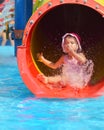 Outdoor portrait of young smiling child having fun in aquapark Royalty Free Stock Photo