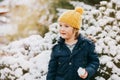 Outdoor portrait of young 6 year old boy wearing warm jacke