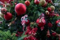 Outdoor pretty decorated Christmas tree with bright red balls and toys