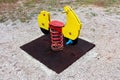 Outdoor public playground equipment wooden vintage looking motorcycle spring rider