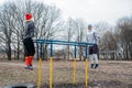 Outdoor Pull-up Bar and Parallel Bars workout. Socially distant bootcamps. Group fitness workout classes outdoors in Royalty Free Stock Photo