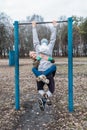 Outdoor Pull-up Bar and Parallel Bars workout. Socially distant bootcamps. Group fitness workout classes outdoors in Royalty Free Stock Photo