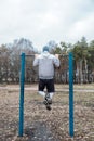 Outdoor Pull-up Bar and Parallel Bars workout. Socially distant bootcamps. Group fitness workout classes outdoors in Royalty Free Stock Photo