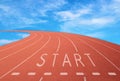 Outdoor racetrack with sign start with blue sky background