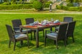 Outdoor rattan furniture, table and chairs Royalty Free Stock Photo