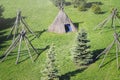 Outdoor recreation. Real nature.Straw wigwam on a glade on a sunny spring day. Wigwam type thatch huts Royalty Free Stock Photo