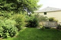 Outdoor rest area. Garden with bench Royalty Free Stock Photo