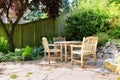 Outdoor rest area with rustic table and chairs