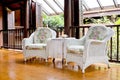 Outdoor rest area with white nice armchair sofa,