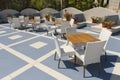 Outdoor restaurant at the beach. Cafe on the beach, ocean and sky. Table setting at tropical beach restaurant photo Royalty Free Stock Photo