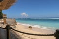 Outdoor restaurant at the beach. Cafe on the beach, ocean and sky. View to beach from bar in Bali, Indonesia. Relaxing on remote Royalty Free Stock Photo