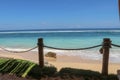 Outdoor restaurant at the beach. Cafe on the beach, ocean and sky. View to beach from bar in Bali, Indonesia. Relaxing on remote Royalty Free Stock Photo