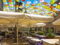 Outdoor restaurant in the city of Jerusalem under colorful umbrellas. Israel Royalty Free Stock Photo