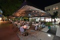 Outdoor restaurant on Lincoln Road Mall in Miami Beach, Florida at night. Royalty Free Stock Photo