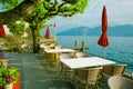 Outdoor restaurant over lake and mountains in the background