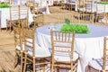 Outdoor restaurant patio furniture table and chairs service for wedding holidays event sunny bright photography Royalty Free Stock Photo
