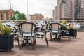 Outdoor restaurant tables and chairs in St Katherine\'s Dock in London, UK Royalty Free Stock Photo