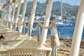 Outdoor restaurant tables at sea coast. Sea shore cafe on Ibiza island Royalty Free Stock Photo