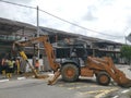 Outdoor scene of workers digging and piling concrete pole preparation for 5G cable connection