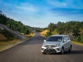 Outdoor scenery during day time at the highway with a compact car. Royalty Free Stock Photo