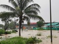 Outdoor scenery during raining season with flash flood at Menggatal Road.