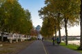 people walk and ride bicycle on promenade riverside of Meuse river and Bonnefantenmuseum in Maastricht, Netherlands. Royalty Free Stock Photo