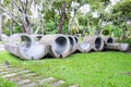 Outdoor sculpture gray concrete tube in garden Royalty Free Stock Photo
