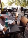 Outdoor seaside dining table & cutlery setting Royalty Free Stock Photo
