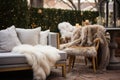 outdoor seating area dressed with fur throws