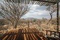 Outdoor seating area of a private hut in Waterberg Guest Farm, Namibia. Beer on table with chairs for relaxation Royalty Free Stock Photo