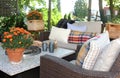 Outdoor seating arrangement around a gas fire pit table in the fall