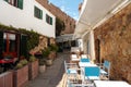 Outdoor seating of mediterranean restaurant. El fresco dining with empty chairs Royalty Free Stock Photo