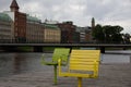 The outdoor seats by the canal is empty in downtown MalmÃÂ¶, Sweden, as people stays home during this overcast day
