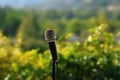 Outdoor serenade Microphone stands amidst nature, echoing music and awareness