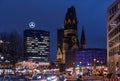 Night cityscape of Breitscheidplatz with ancient clock tower of Kaiser Wilhelm Memorial Church named `the hollow tooth` Berlin. Royalty Free Stock Photo