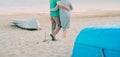 Outdoor shot of romantic senior couple walking along the sea shore holding hands. Senior man and woman walking on the beach togeth Royalty Free Stock Photo