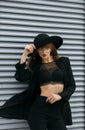 Stylish girl with red lips wears black bra and hat Royalty Free Stock Photo