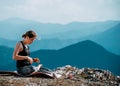 Outdoor shot of woman doing yoga exercise at the hill Royalty Free Stock Photo