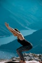 Outdoor shot of woman doing yoga exercise at the hill Royalty Free Stock Photo