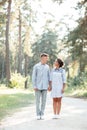 Outdoor shot of young happy couple in love on sunny day on nature. Man and woman hugging, sunlight in summer park. valentine`s da Royalty Free Stock Photo