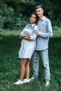 Outdoor shot of young happy couple in love on sunny day on nature. Man and woman hugging  sunlight in summer park. Royalty Free Stock Photo