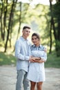 Outdoor shot of young happy couple in love on sunny day on nature. Man and woman hugging, sunlight in summer park. valentine`s da Royalty Free Stock Photo