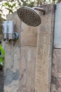 Outdoor shower at swimming pool.  shower cabins behind outdoor swim pool .Outdoor shower area design at the beach, seaside or swi Royalty Free Stock Photo